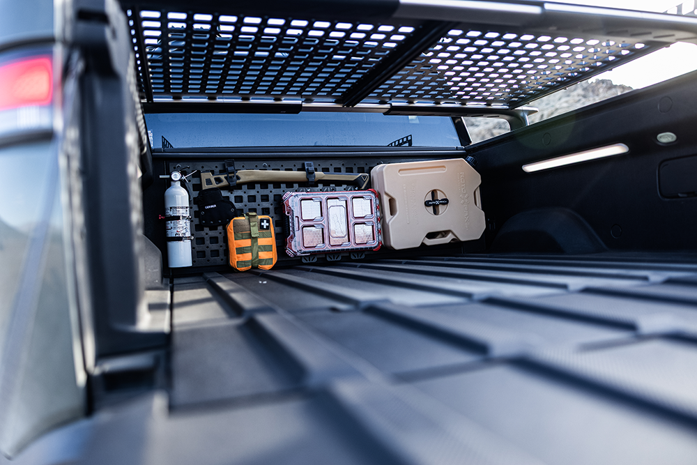 Rivian electric vehicle with overland gear, roof racks, and camping equipment from Overland Nomadic